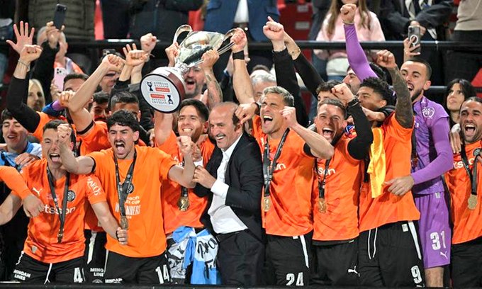 OFI celebrating with the trophy